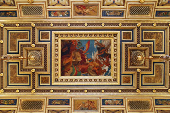 frescos in guilded frames on the ceiling of the hall