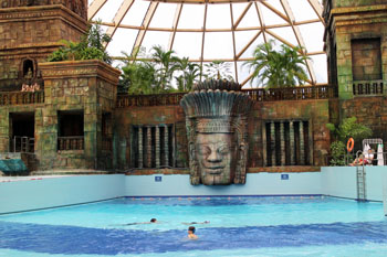 the wave pool with a Mayan guide statue in the backgroun, Aquaworld