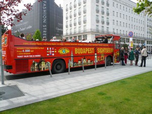 a red Sightseeing Bus