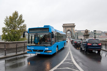 a blue Bus on the Chain Bridge Budapest