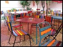 Colorful chairs in Kőleves's garden