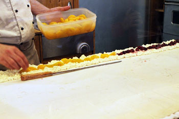 putting the apricot filling on the strudel dough