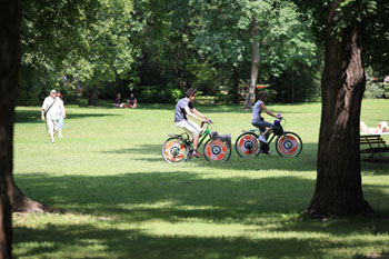 two bikers on the green lawn of Margaret Island