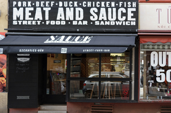 the black entrance of meat and sauce with the name displayed in big white font