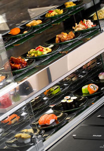 sushi on conveyor belt in Wasabi
