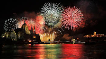 fireworks in all colour, over the Danube the Chain Bridge, the Parliament