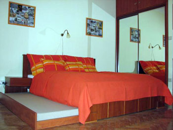 The single bedroom in Paprika Apt