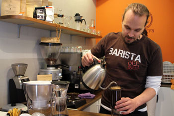 Krisztian making coffee with AeroPress in Mantra