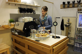 Anna making flat white In Kontakt cafe