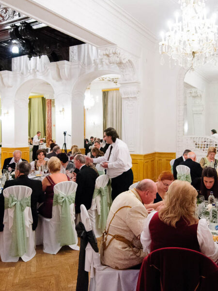 guests seated at a festive dinne rin Danube Palace
