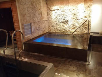 a small square indoor pool in the Spa