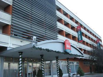 the entrance and facade of Ibis Aero Hotel