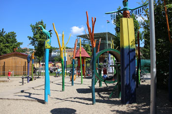 colorful wooden toys in the playground in summer