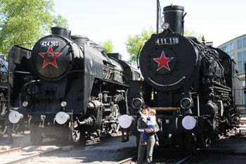 two black steam engines with a red Russian star on their front