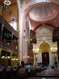 the domed interior of the synagogue with visitors