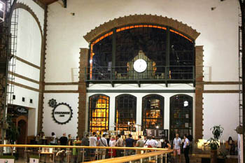 a queue at the cafe inside the spacious market hall