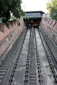 funicular with a car going upwards on the rails