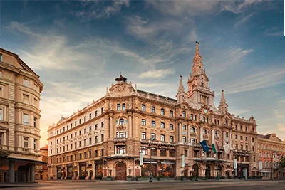 New York Palace's top facade under a clear blue sky