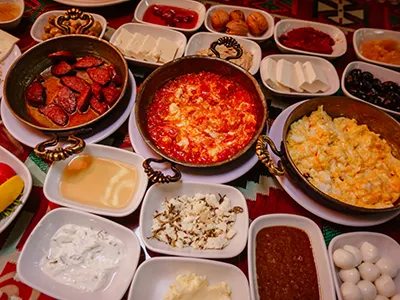 various Spanish food and tapas ingredients in bowls and on plates
